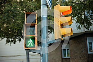 Pedestrian Crossing green light - Yellow Painted Traffic Signal on Steel Pole in Barcelona, Spain