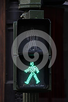 Pedestrian crossing lights and traffic lights, green