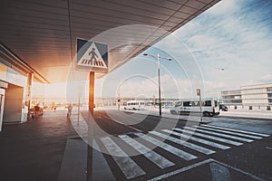 Pedestrian crossing next to airport entrance