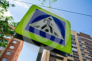 Pedestrian crossing sign on the city street