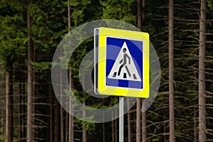 Pedestrian crossing sign on forest background