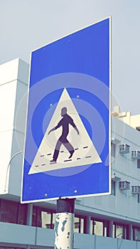 Pedestrian Crossing Sign in Muscat. Traffic signs. Soft Daylight. Outdoor. Filtered Photo