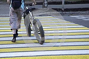 Pedestrian crosswalk in the city. Yellow and white pedestrian crosswalk