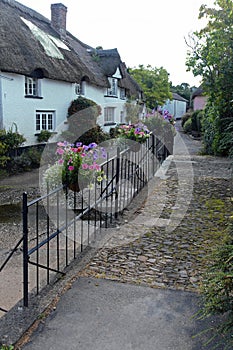 Pedestrian footbridge over a stream on the edge of a Devon village