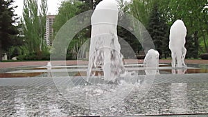 Pedestrian fountain with color music in the city park.