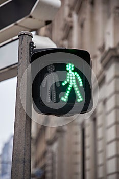 Pedestrian green light on a traffic light, abiding by the French and European traffic regulations