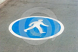 Pedestrian lane sign on asphalt