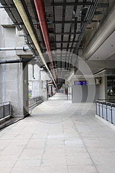 Pedestrian pathway or corridor or hallway between train station and airport building