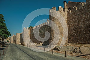 Pedestrian promenade beside large city wall at Avila