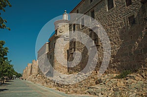 Pedestrian promenade beside large city wall at Avila