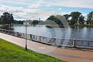 Pedestrian sidewalk around city lake embankment