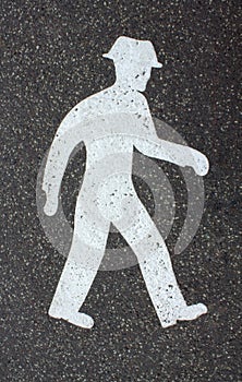 Pedestrian sign on asphalt way