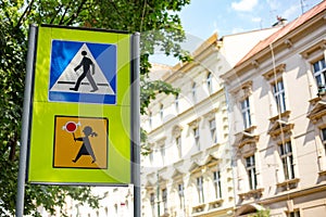 Pedestrian sign in Poland. Warning road sign with a picture of children. Blue and white crosswalk sign