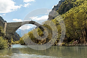 Pedestrian stone bridge Konitsa over river Aoos or Vjose in northwestern Greece, Europe.