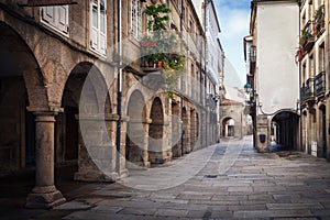 Pedestrian street and historic building facades in old town Santiago de Compostela, Spain