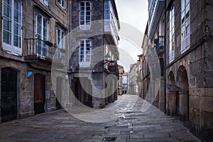 Pedestrian street and historic building facades in old town Santiago de Compostela, Spain