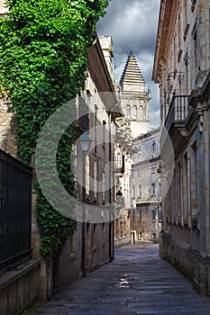 Pedestrian street and historic building facades in old town Santiago de Compostela, Spain