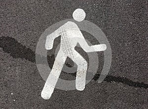 Pedestrian street sign on asphalt floor