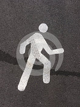 Pedestrian street sign on asphalt floor