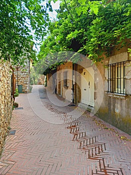 Pedestrian street in small village in the countryside. Rural tourism, architecture and constructions