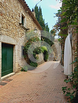 Pedestrian street in small village in the countryside. Rural tourism, architecture and constructions