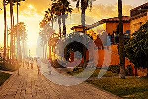 Pedestrian street at sunset in Playa de la Americas in Tenerife, Canary Islands