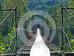 Pedestrian suspended bridge over the Maggia River, Magic Valley or Valle Magia Valle Maggia