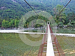 Pedestrian suspended bridge over the Maggia River, Magic Valley or Valle Magia Valle Maggia photo