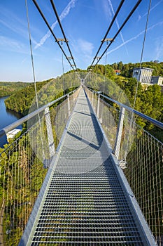 Pedestrian suspension bridge above Rappbodetalsperre lake and Rappbode River in Harz Mountains National Park, Germany