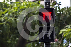 Pedestrian traffic light stylized with oriental themes in Liberdade neighborhood photo