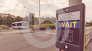 Pedestrian Wait Sign at Pelican crossing in both English and Welsh languages B