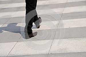 A Pedestrian Walking on a Zebra Crossing