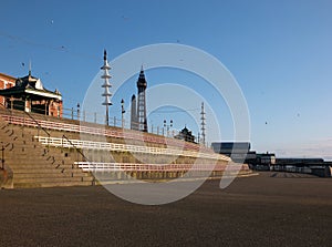 Pedestrian walkway near blackpool north pier with benches and shelter on the promenade