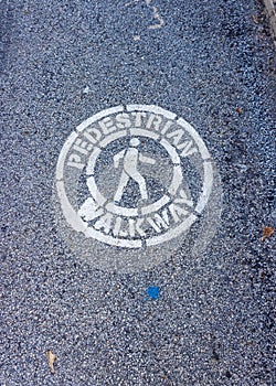 A Pedestrian Walkway Sign on a Road