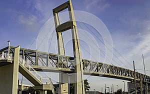 Suspension bridge walkway  over a busy streeet during the early morning commute at Orlando Floridaosiing photo