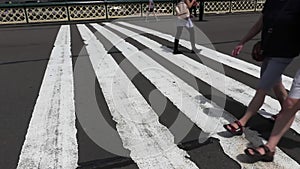 Pedestrians walking across a bridge. Pyrmont Bridge Sydney.