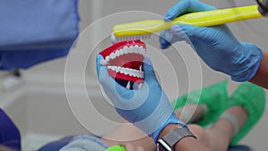 pediatric dentist teaches in proper brushing and oral hygiene