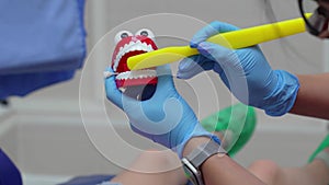 pediatric dentist teaches in proper brushing and oral hygiene