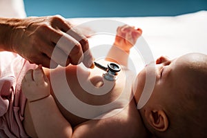 Pediatric doctor exams little baby. Health care, medical examination, people concept