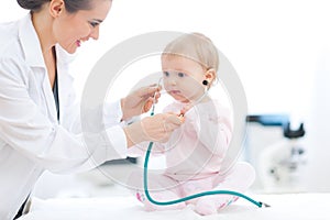 Pediatric doctor wearing baby stethoscope