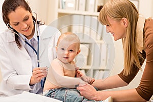 Pediatrician check-up baby girl with stethoscope