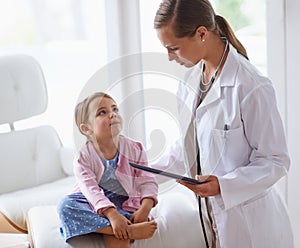 Pediatrician, child and tablet at pediatric hospital for health examination, wellness and support. Medical professional