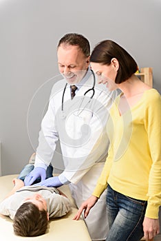 Pediatrician doctor examining child