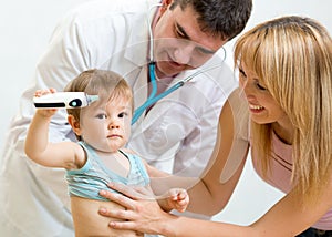 Pediatrician doctor examining child. Mother