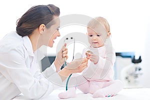 Pediatrician doctor showing baby stethoscope