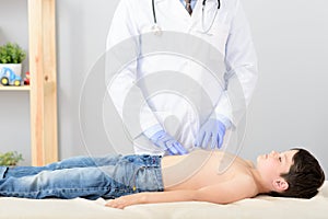 Pediatrician doing checkup on young boy