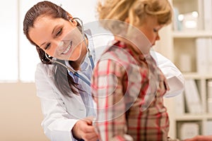 Pediatrician examine child girl with stethoscope