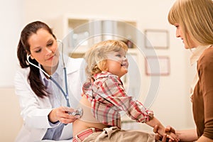 Pediatrician examine child girl with stethoscope