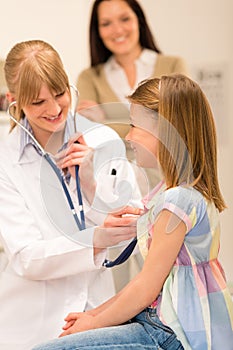 Pediatrician examine girl chest with stethoscope