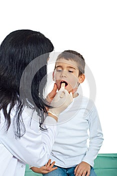 Pediatrician examine throat kid photo